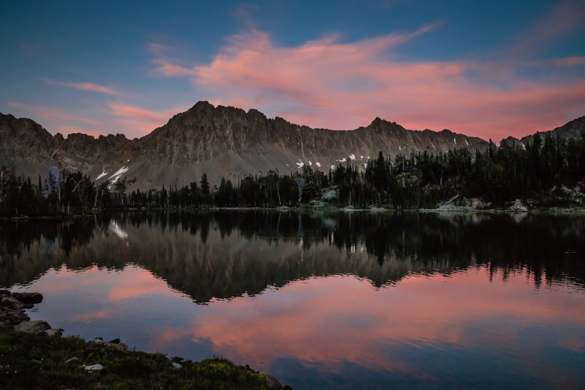 Pink clouds reflect off Campfire Lake in the Crazy Mountains near Livingston, MT.
