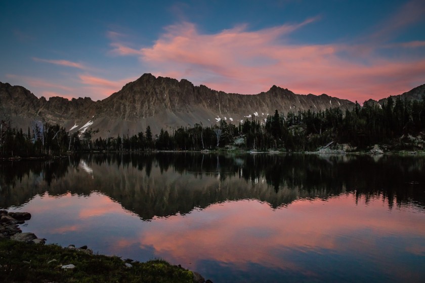 Pink clouds reflect off Campfire Lake in the Crazy Mountains near Livingston, MT.