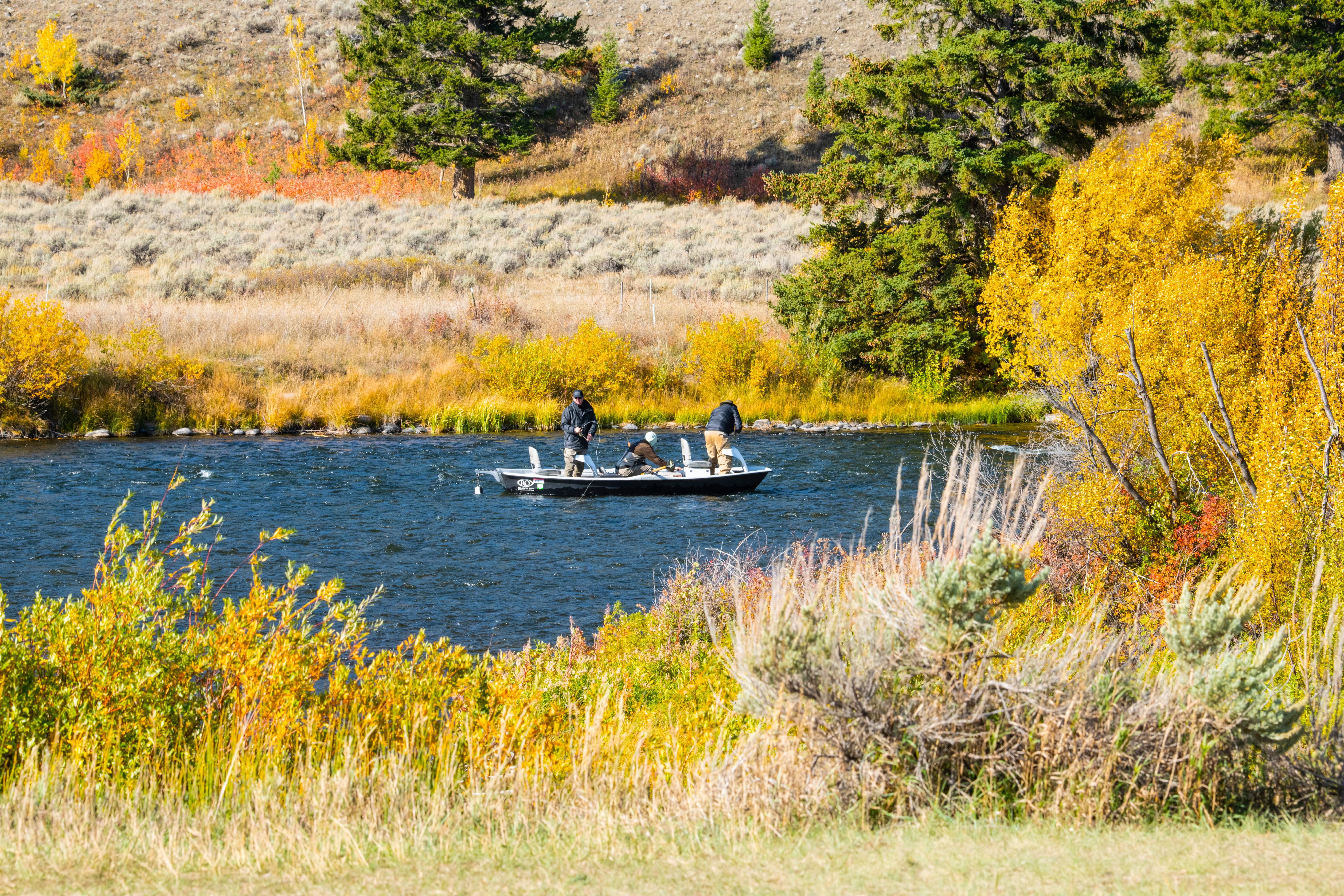 Fishing on a dory drift boat on the Madison River