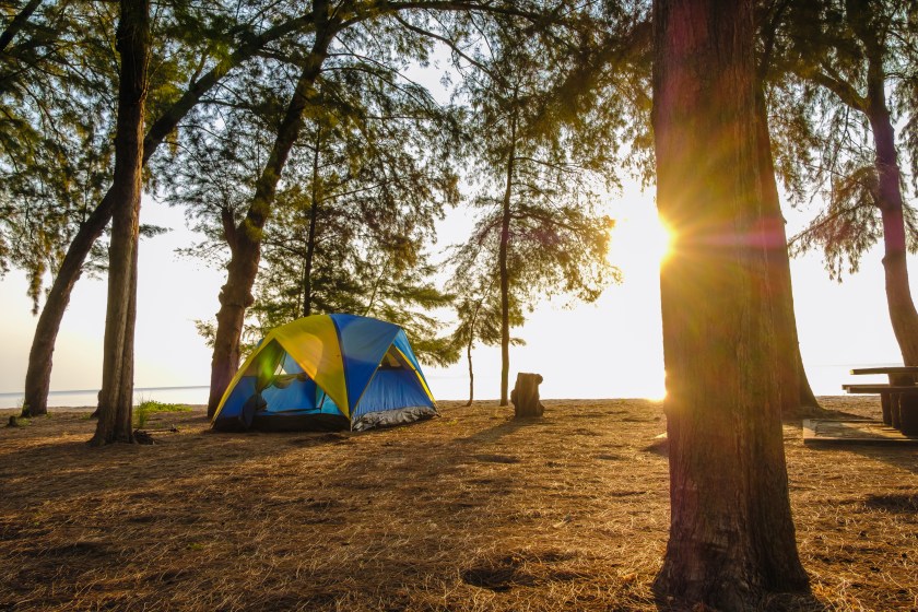 Spread the seaside tent for a relaxing holiday,camping with sunrise in morning