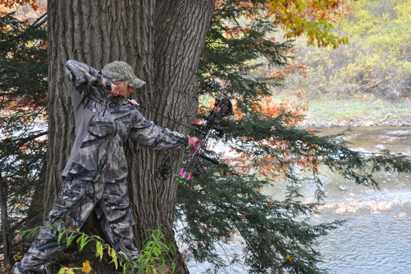 Female Hunter With Her Bow Pulled Back....