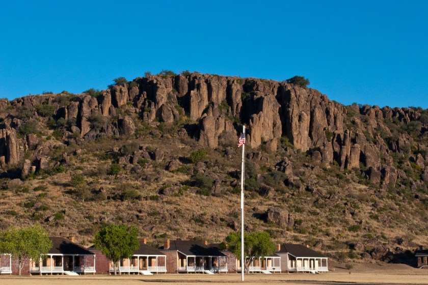 North America, USA, Fort Davis National Historic Site, Texas, Parade Grounds, Restored Officers Kitchen and Servants Quarters Framed by Davis Mountains Park Ridge. (Photo by: Education Images/Universal Images Group via Getty Images)