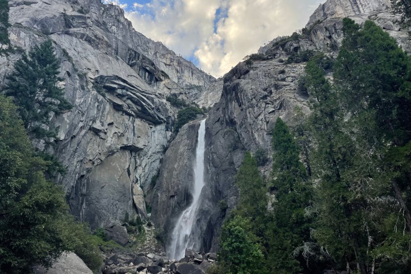 A mountain and waterfall view in Lower Yosemite Falls