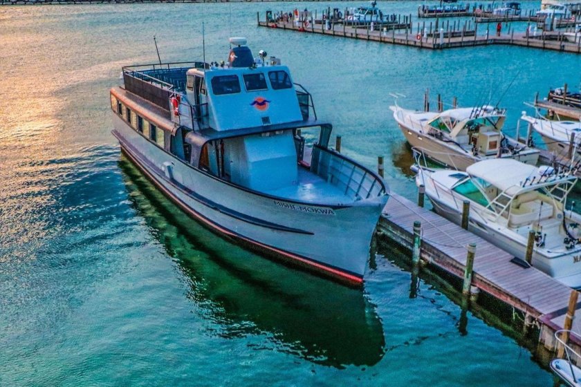 A boat that is docked, ready to transfer travelers to Manitou Island
