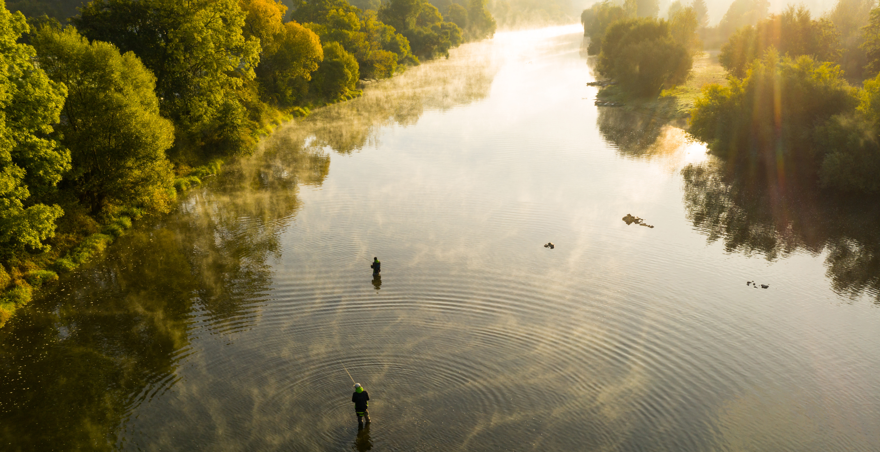 fishing in the river at sunrise