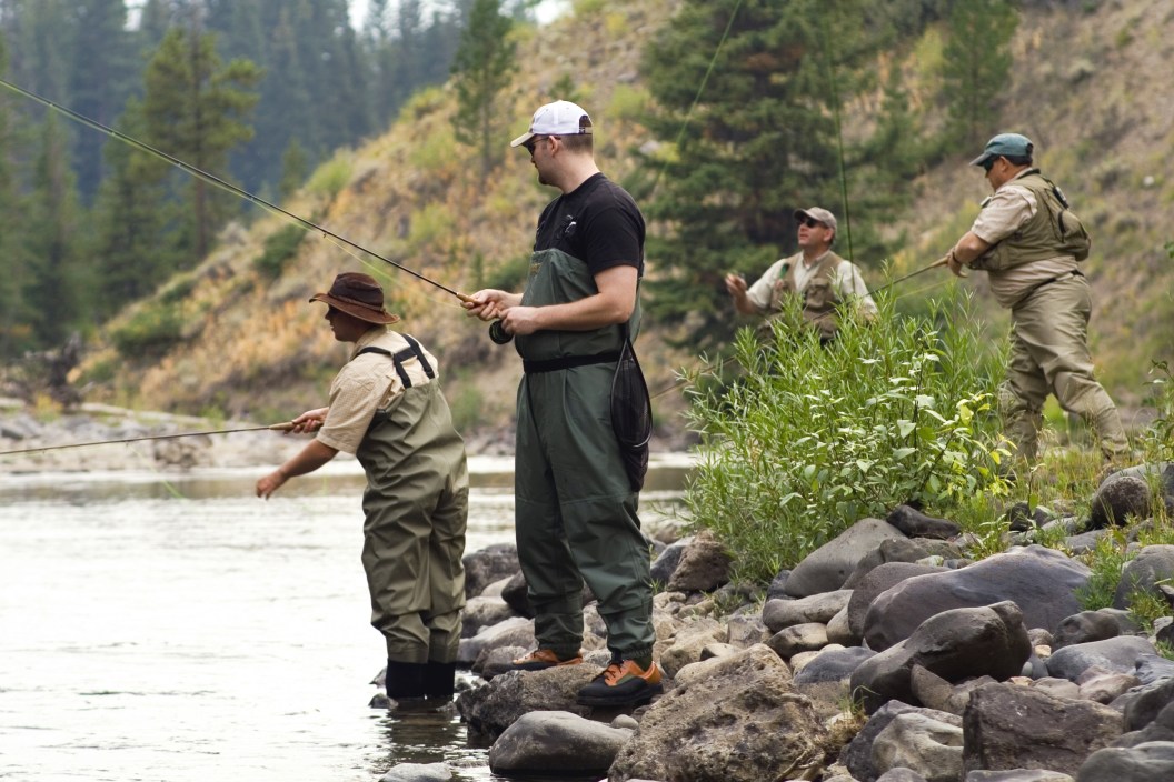 a group of four dry fly fishermen