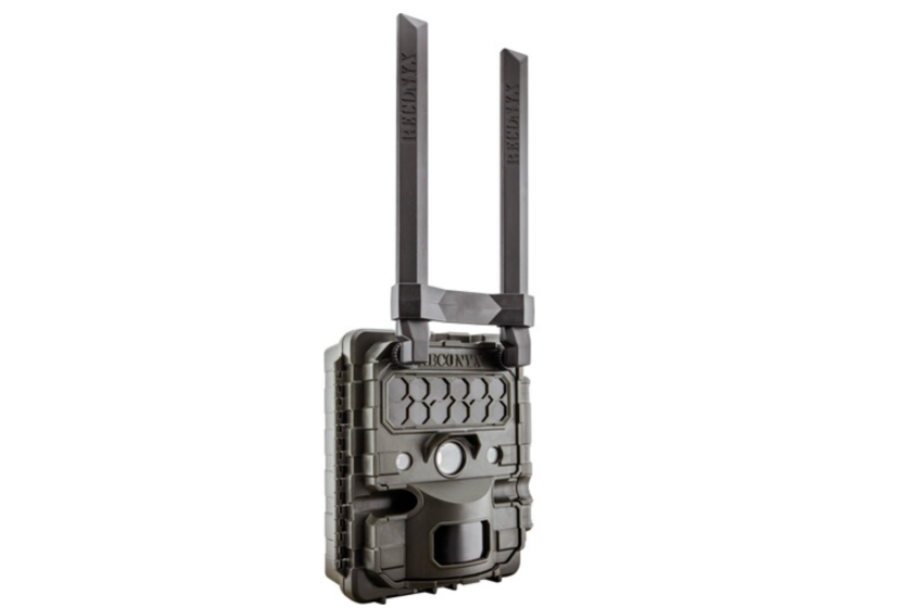 A black trail camera with two antennae sticking out of it