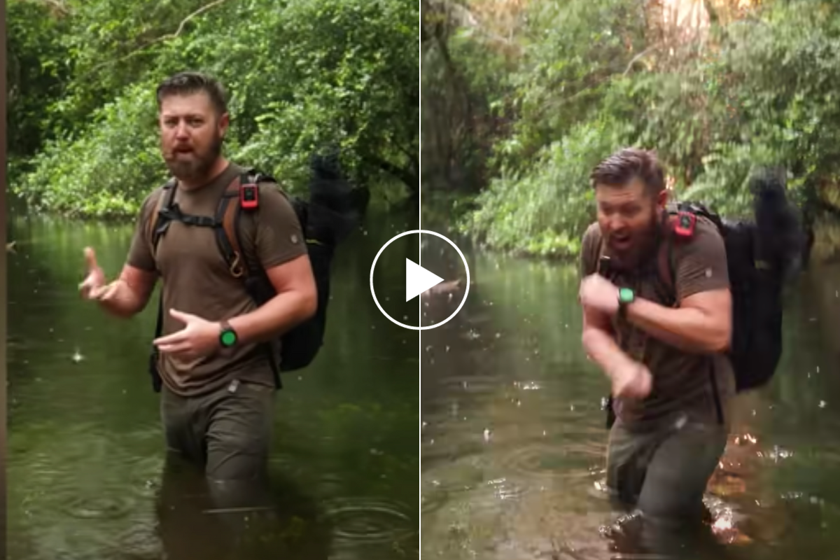 Forrest Galante standing in the water filming.