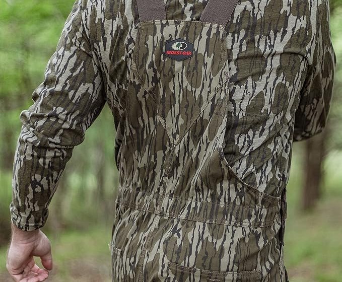 Person wearing Mossy Oak overalls