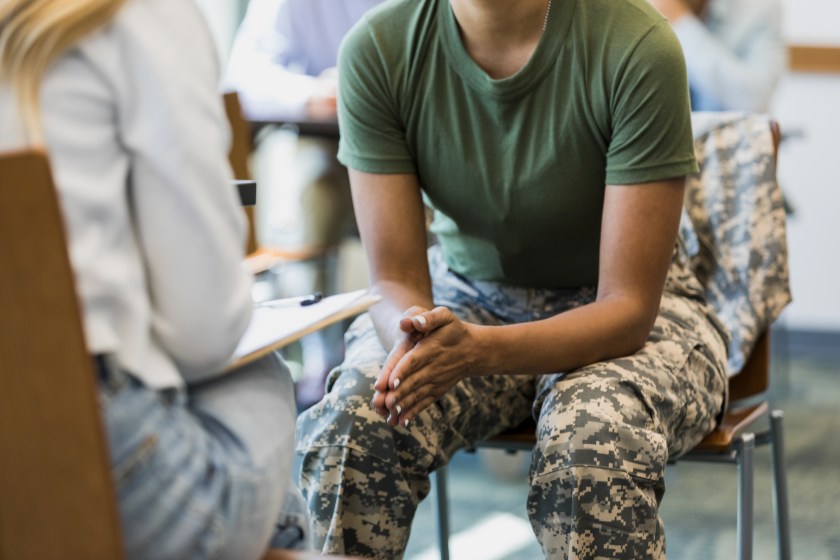 A female veteran talks to a counselor about mental health issues.