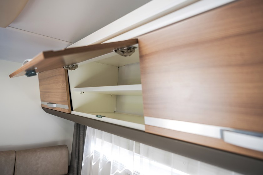Elegant Camper Van Overhead Cabinet Storage Area. Modern Motorhome RV Recreational Vehicle Features.