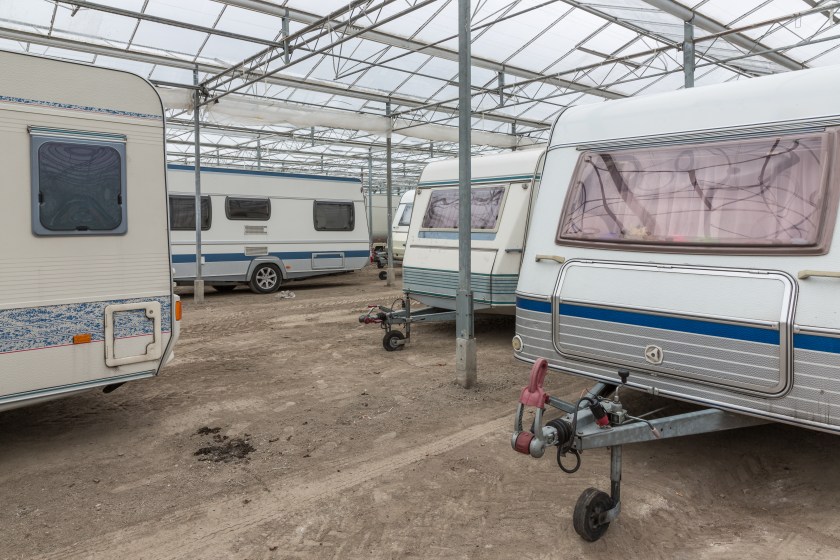 Caravan parking in an empty Dutch Greenhouse.