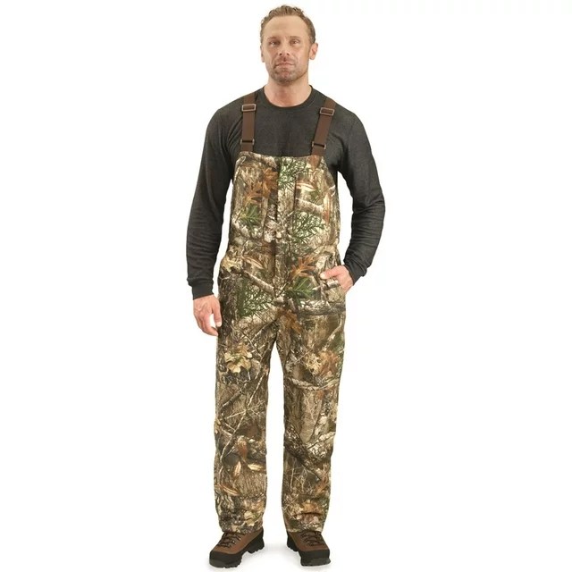 Person wearing camo hunting overalls