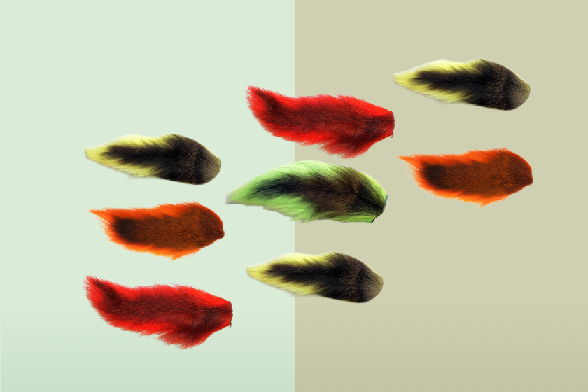 A colorful series of bucktails on a mint green background
