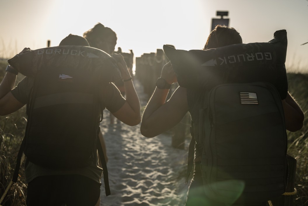 Two people walking with GoRuck Packs on their backs