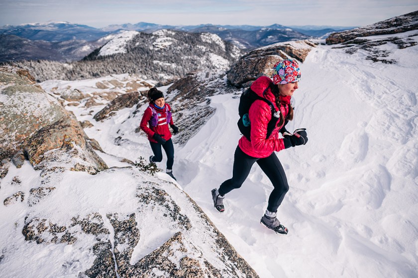 Two people hiking wearing shoes with Kahtoola Spikes