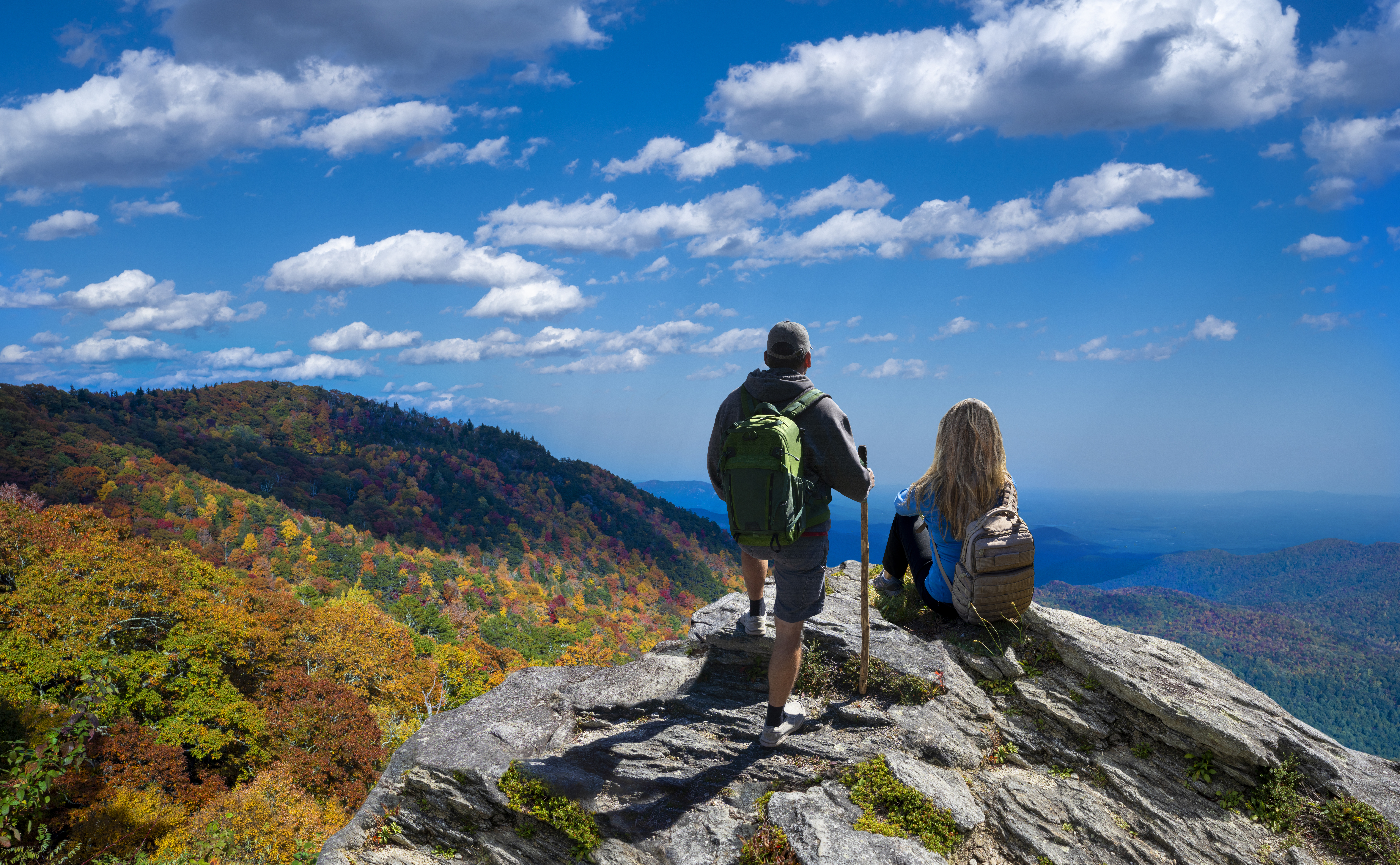 People on top of the mountain enjoying beautiful autumn scenery. Blue Ridge Mountains, near Asheville, North Carolina, USA
