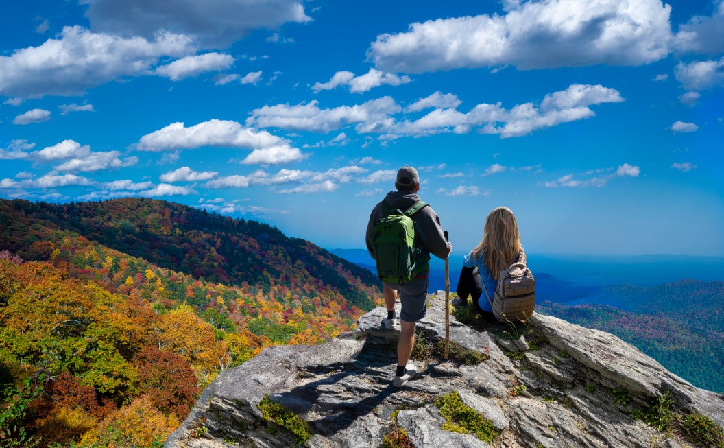 People on top of the mountain enjoying beautiful autumn scenery. Blue Ridge Mountains, near Asheville, North Carolina, USA