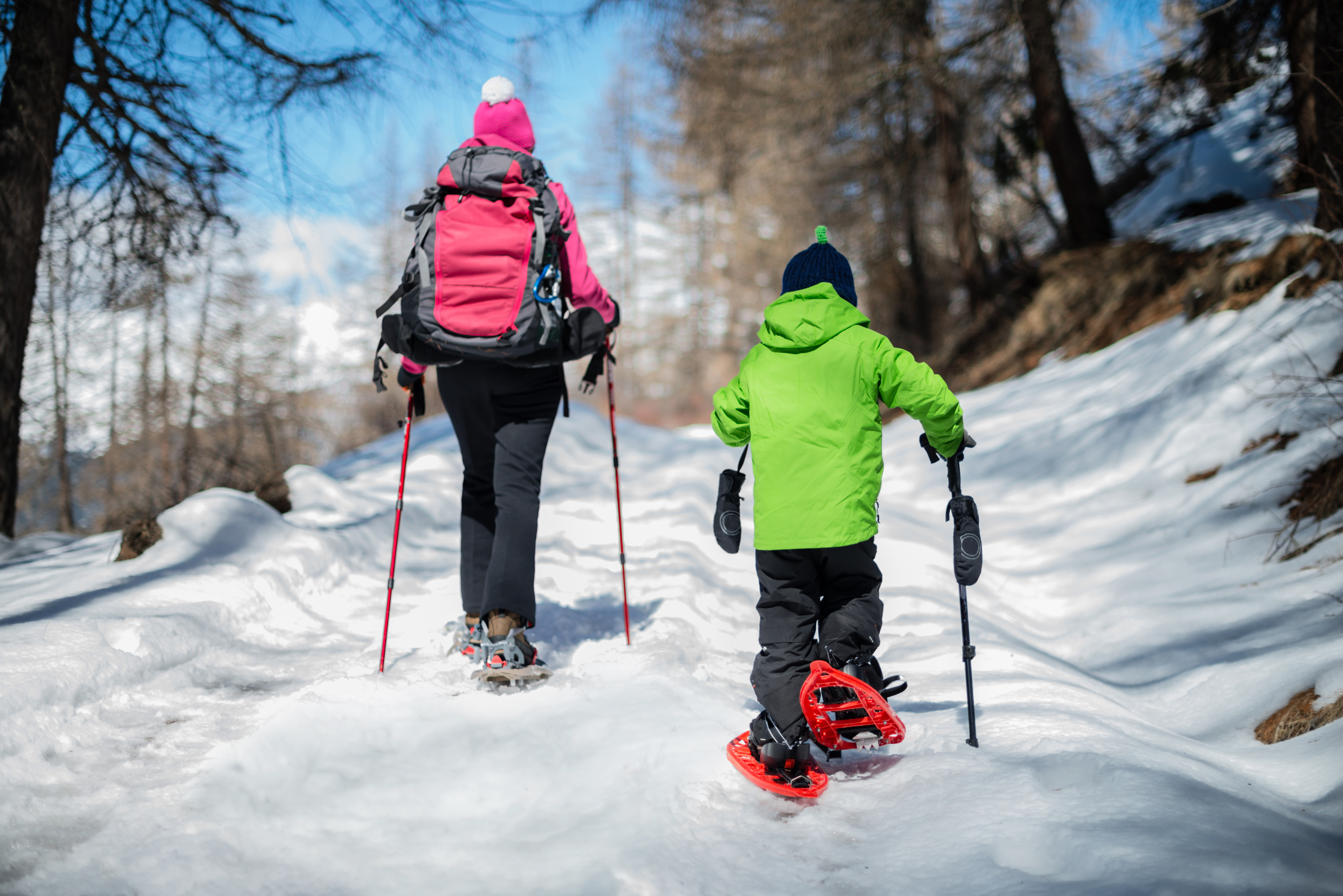 Woman snowshoeing in a sunny day