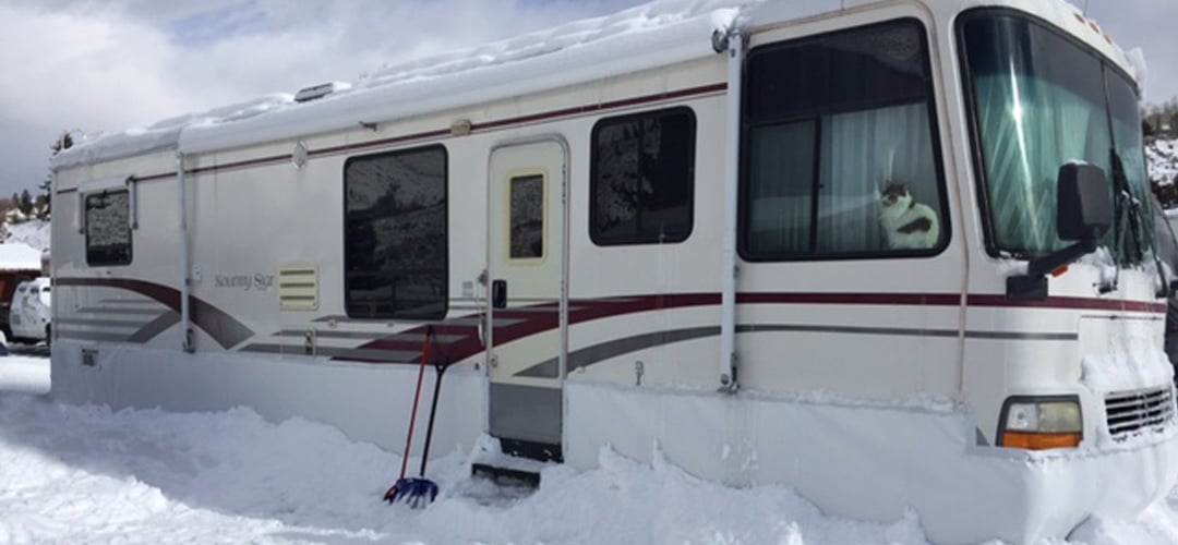 Skirting along an RV in the snow.