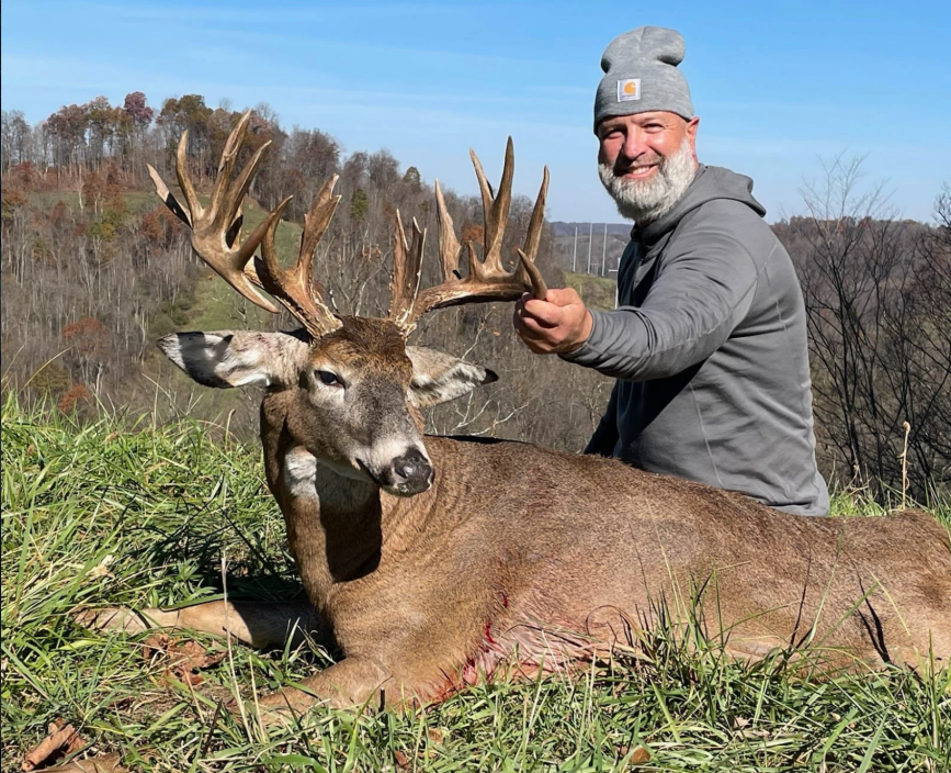 Jason Shenkel poses with his prize buck