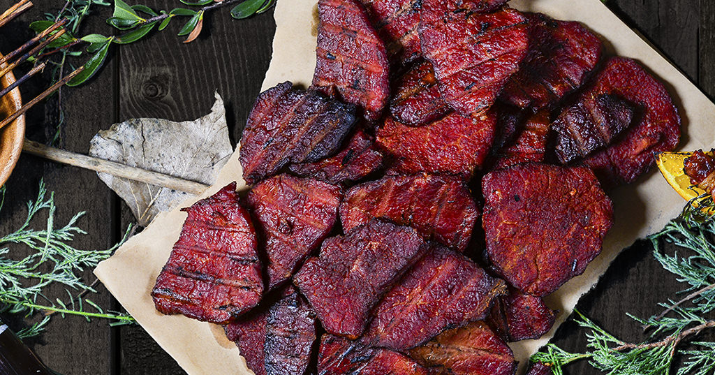 A close up on a large dish of teriyaki deer jerky