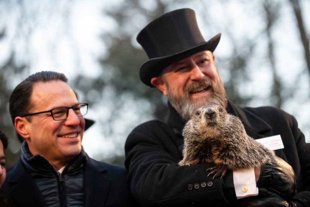 Pennsylvania Governor Josh Shapiro poses for a portrait with Groundhog handler AJ Dereume and Punxsutawney Phil, who saw his shadow, predicting a late spring during the 137th annual Groundhog Day festivities on February 2, 2023 in Punxsutawney, Pennsylvania.