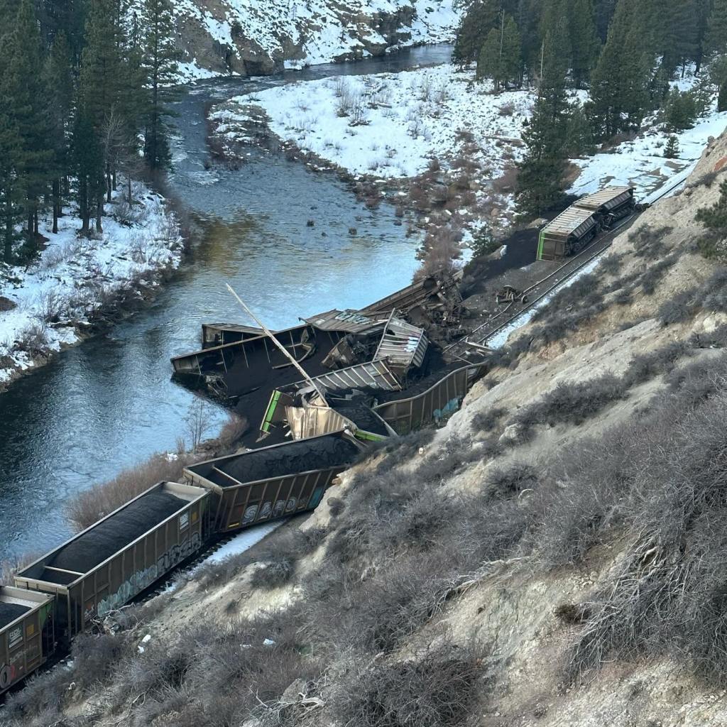 Train hangs off track into Feather River. 