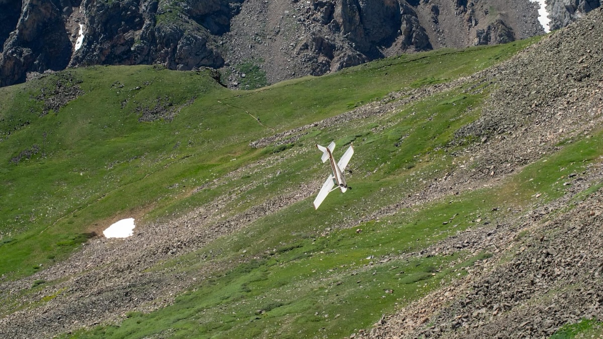 A plane almost crashing into the side of a mountain.