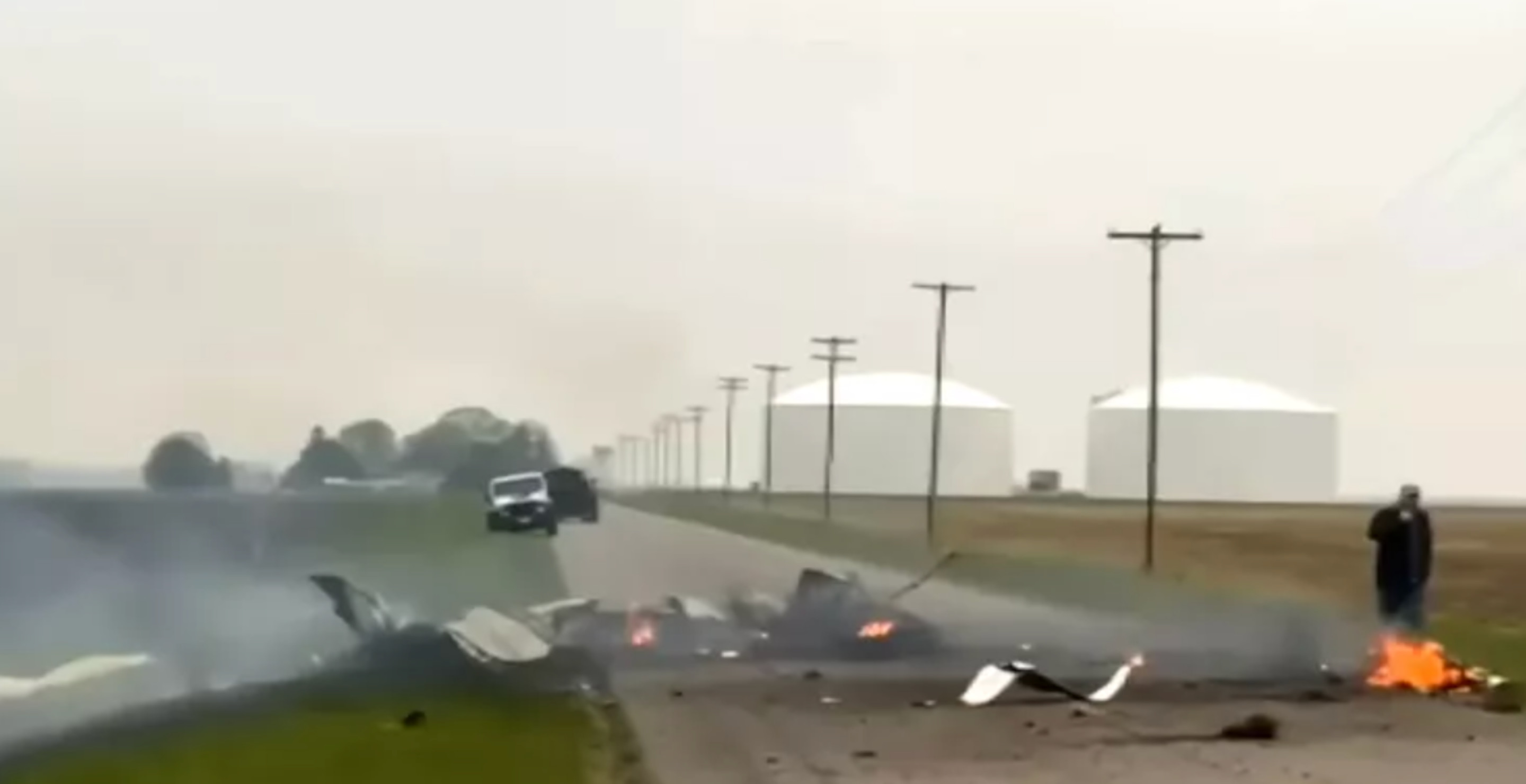 Small Plane Hits Power Lines And Crashes Into Road Way, No Survivors