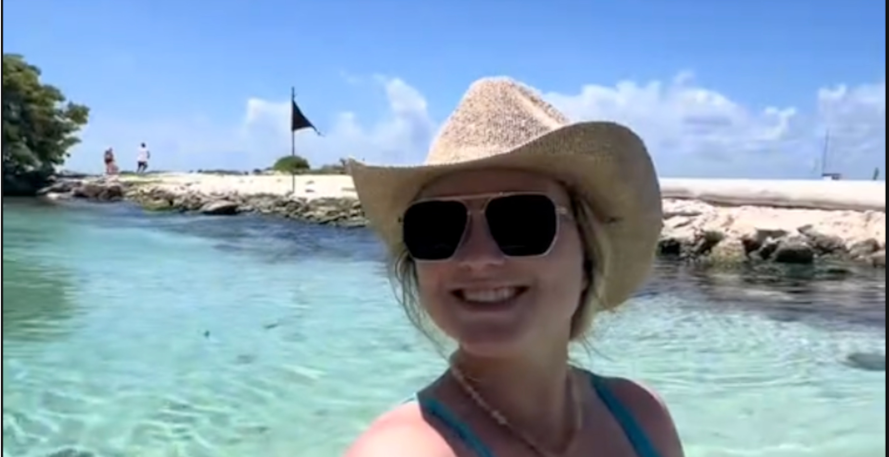 Oblivious Tourist Isn't Aware That She's Sharing The Water With A Crocodile